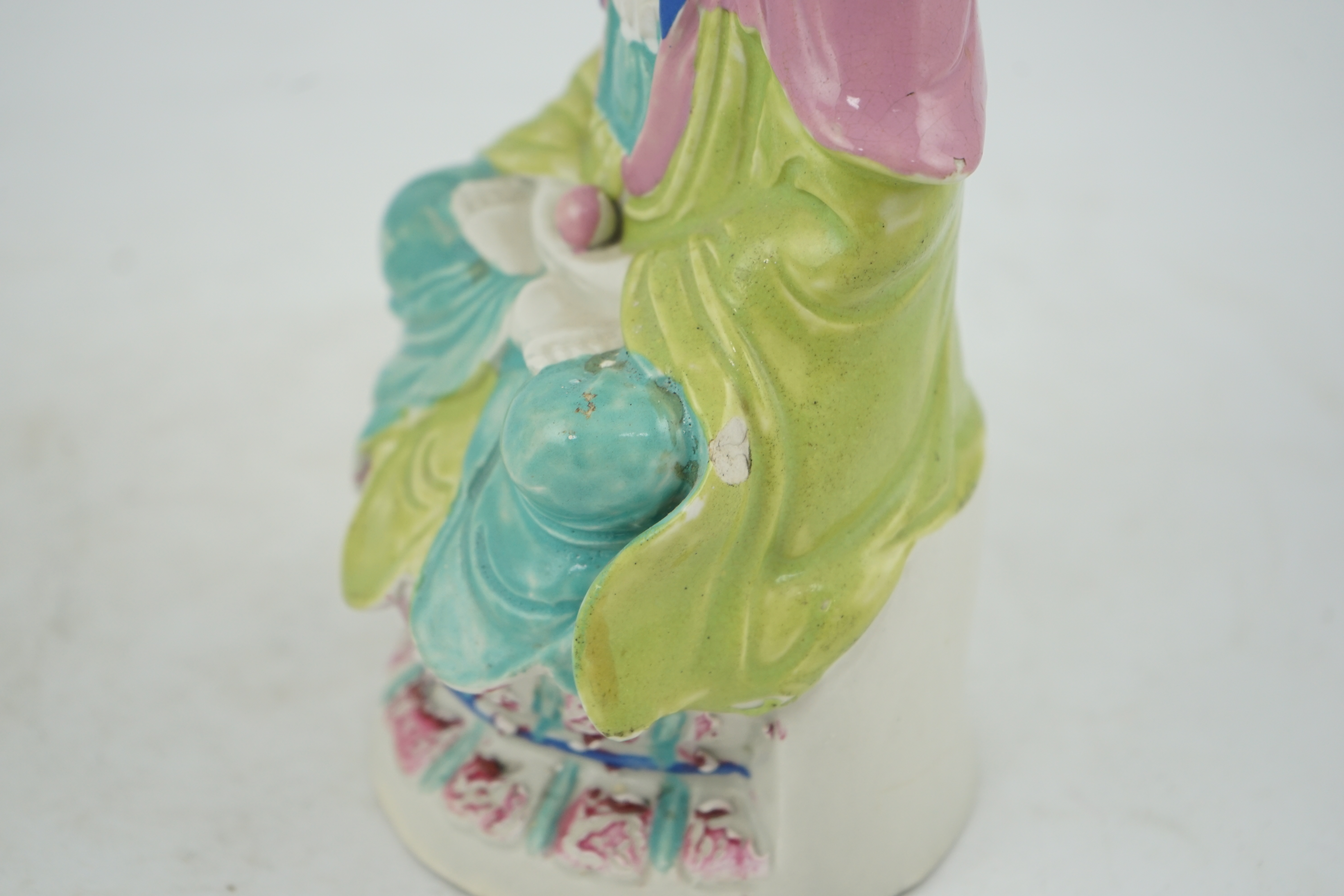 A Chinese Dehua polychrome enamelled blanc de chine figure of Guanyin, late 18th century